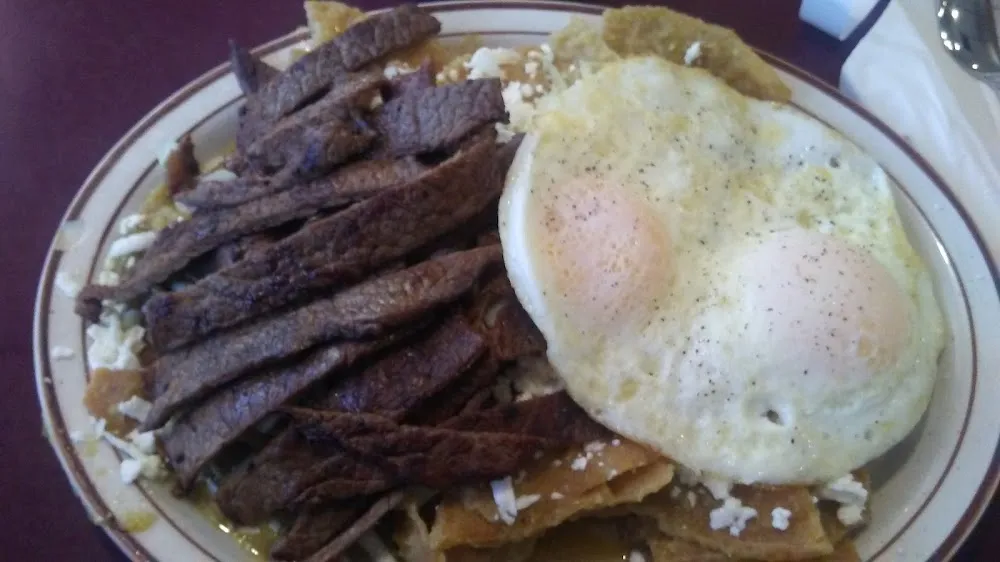 Chilaquiles Verdes with Asada and Eggs