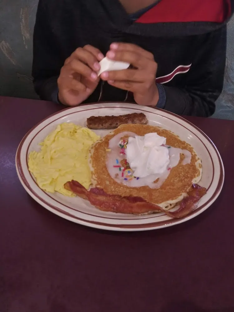 Country Fried Steak Omelette with Onions and American Cheese Topped with Sausage Gravy